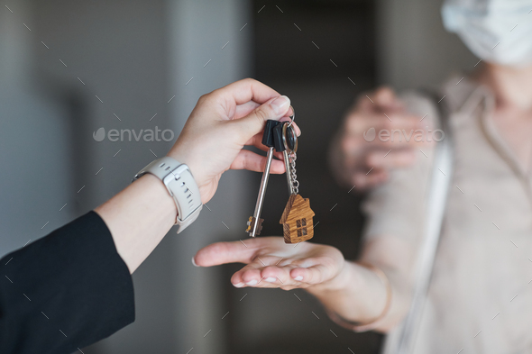 Hand Giving Keys to New House