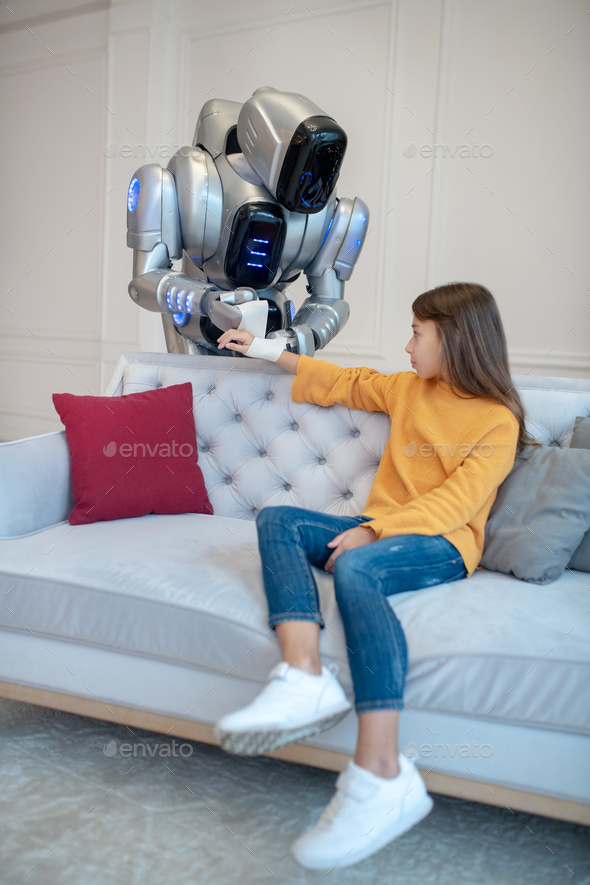 Robot taking care of damaged girls hand