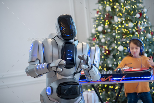 Girl and robot preparing playlist for the new year party