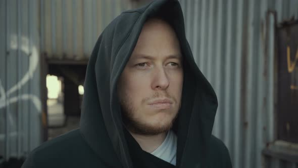 Hipster Man Walks Around an Abandoned Building alt