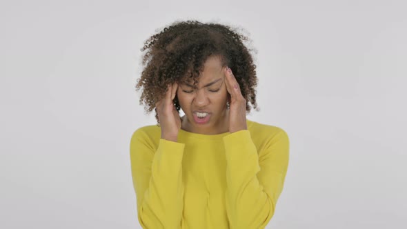 Young African Woman Having Headache on White Background alt