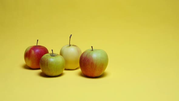Red Apples On Yellow Background