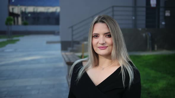 Portrait of a Beautiful Businesswoman Who Talks To Halfconversationalist alt