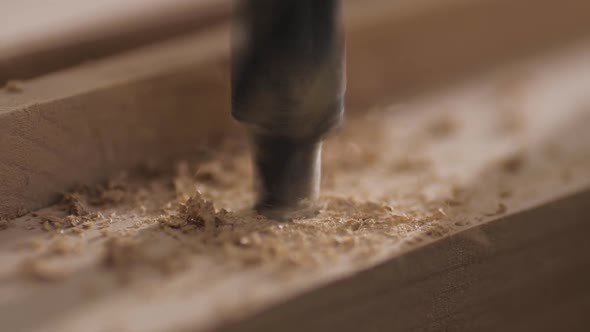 Macro Video of Drilling Holes in the Board with a Drilling Machine