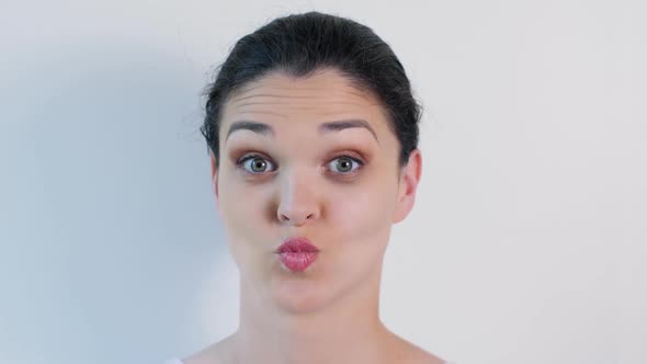 Young Woman Grimacing, Blinking and Having Fun alt