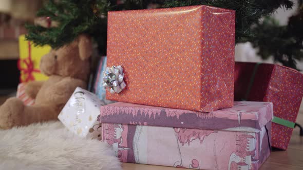 Closeup of Packed Christmas Gifts Under Decorated New Year Tree Indoors alt