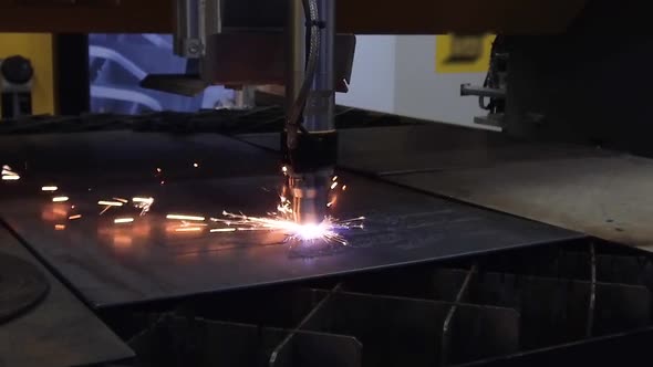 Automatic CNC Plasma Cutting Machine Cuts Details From Steel Sheet