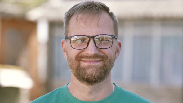 Portrait of a Young Happy Businessman Looking at the Camera alt