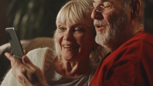 Happy Senior Couple Making Video Call to Relatives alt