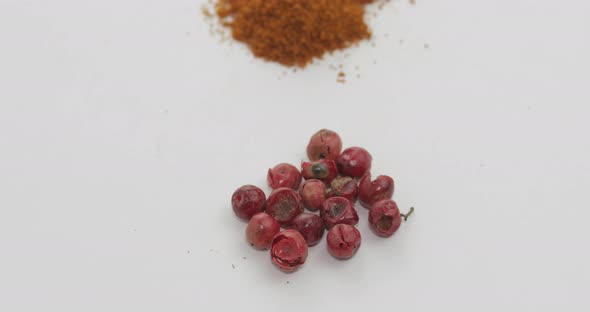 Red Pepper Powder Rotation. Macro Shot Against a White Background alt