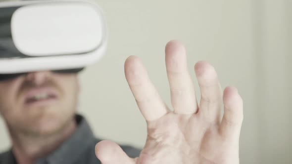 Mid adult man using virtual reality headset