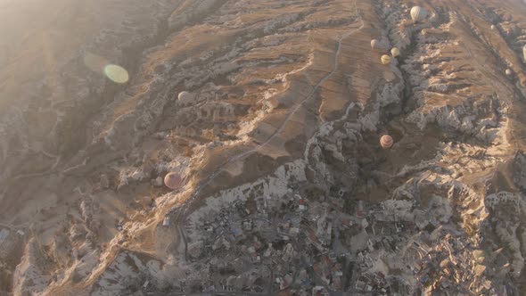 Cappadocia Aerial Shot of Rock Chimneys and Uchisar Castle in Goreme Turkey alt