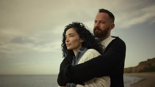 Couple Hugging Enjoying Beach Day Vacation Family Trip at Sea Nature Background alt