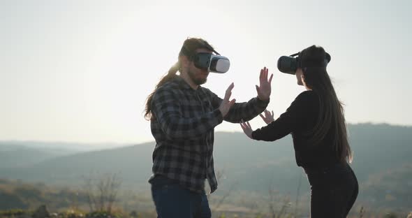 Two People Wearing VR Glasses  alt