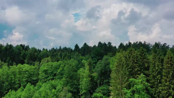Cloudy Sky Over Styrian Forest in Austria, Aerial Crane Shot