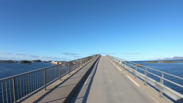Driving a Car on a Road in Norway Lofoten Reine alt