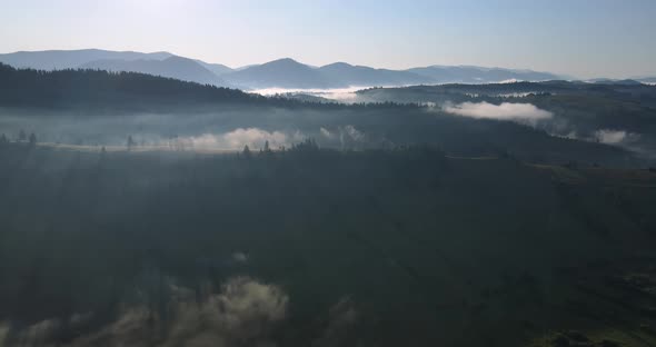 The Sun's Rays Dispel The Fog In The Mountains