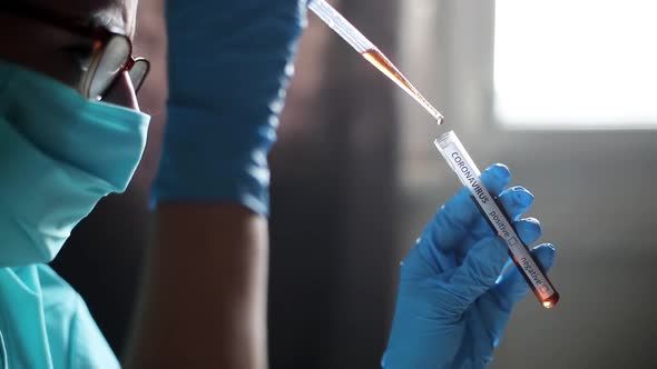 Doctor taking samples from coronavirus COVID-19 test tube