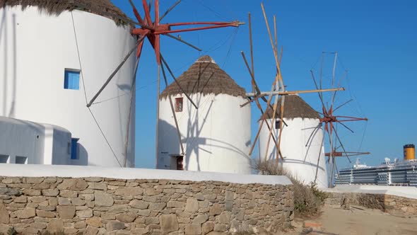Traditional Greek Windmills on Mykonos Island at Sunrise, Cyclades, Greece alt