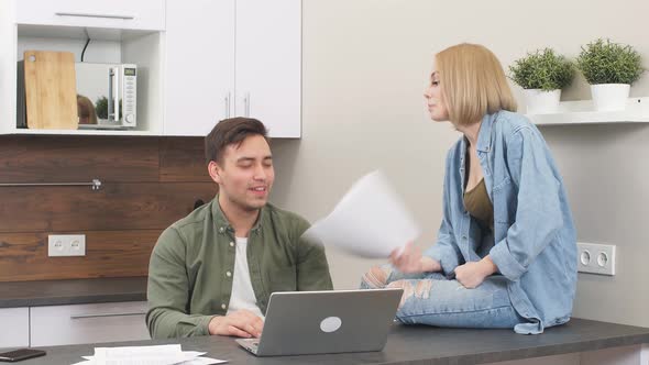 Cheerful Positive Family Sitting in Kitchen Disassembles Paper Bills alt