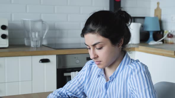 close up portrait beautiful Indian business woman using computer working late browsing internet  alt