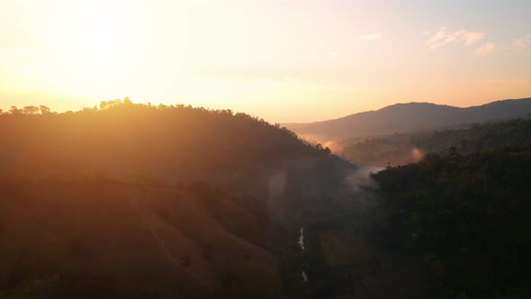 Flying over the clouds during morning sunrise alt
