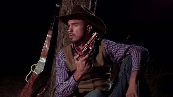 Cowboy with a Gun in the Forest at Night alt