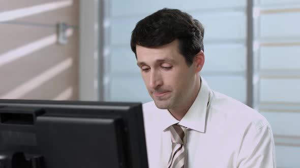 Clerk Working at the Computer. alt