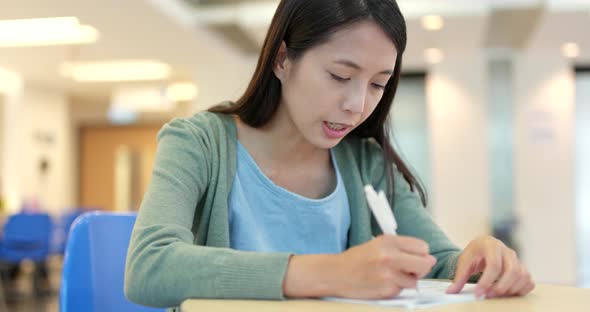 Student study for her exam at school alt