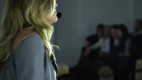 Female Speaker Presentation at Exposition Center alt