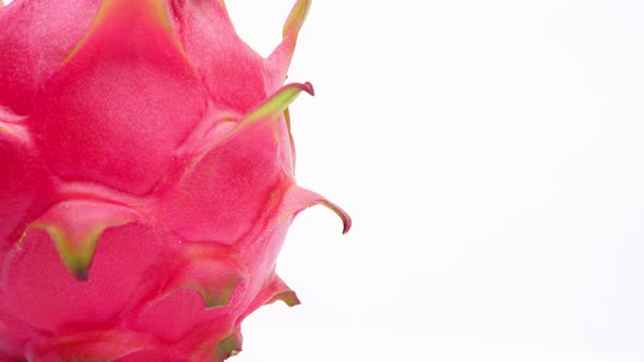 Close up Dragon fruit (Pitaya, Pitahaya) isolated on white background. Rotating shot alt