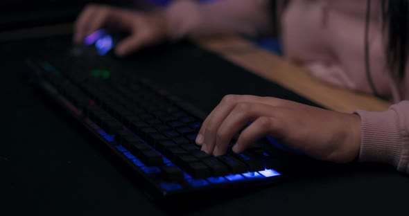 Closeup of Hands of Young Girl Playing on Professional Color Backlit Keyboard Led Lighting Woman alt