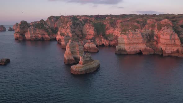 Aerial view of the ocean shore in the evening alt