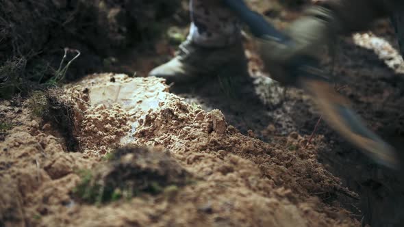 One Soldier Digs a Trench in a Pine Forest alt