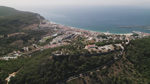 Top down view Sesimbra Natural coastline and Castle on hilltop, mesmerizing Landscape - Portugal alt