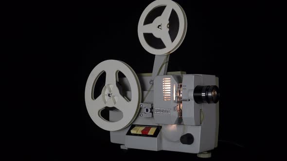 Watching Films On An Old Film Projector.