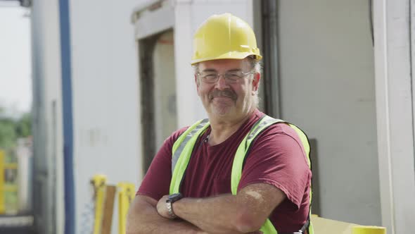 Portrait of truck driver at shipping facility.  Fully released for commercial use.