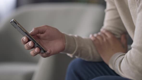 Male Hand Swiping Smartphone Screen Closeup alt