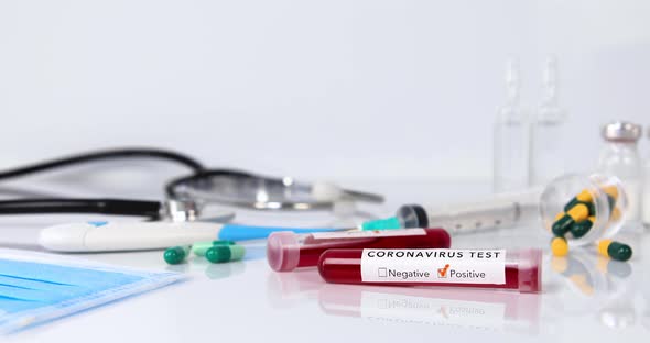 Panning Shot of Blood Test Tube Containing Coronavirus