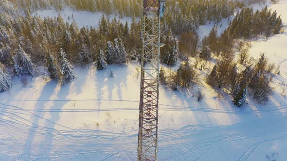 Flying Over Radio Communications Tower Mountain Snow Covered Winter Landscape alt