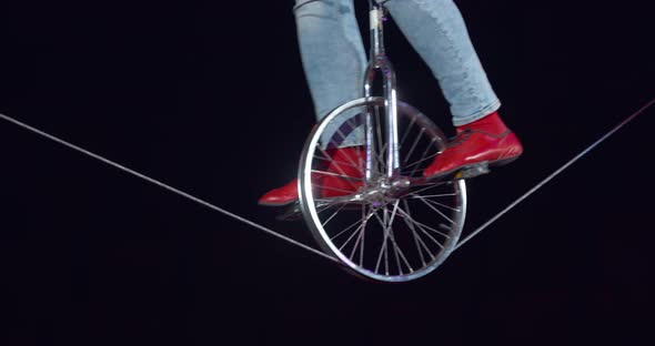 Close Up of a Man on a Unicycle During a Circus Performance alt