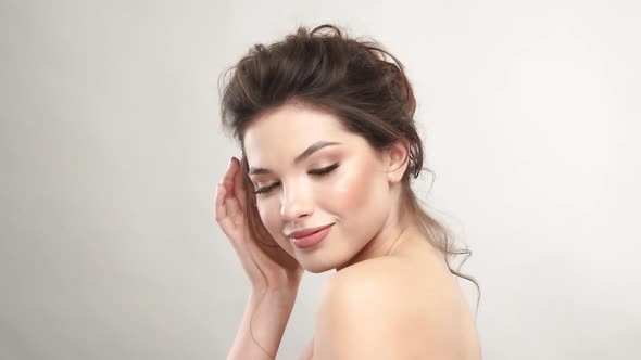 Charming Lady with Naked Shoulders Winking with Eyes alt