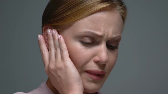 Upset Female Holding Painful Ear, Suddenly Feeling Strong Ache, Health Problem