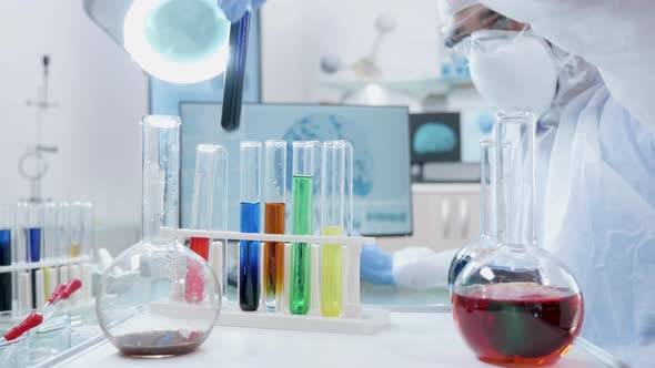 POV Shot of Cart with Different Tubes with Liquid Samples Approaching the Laboratory Desk alt