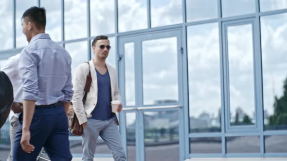 Business People Walking Near Office Building alt