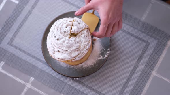 Woman Taking Piece of Traditional Easter Cruffin Cake  Happy Easter Concept alt