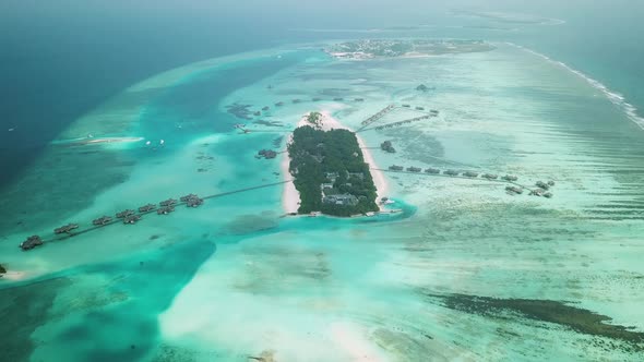 Aerial Drone View of a Beautiful Atoll or Island with a Resort in the Maldives alt