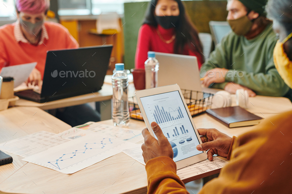 Hands of young it engineer of African ethnicity working over new program - Stock Photo - Images
