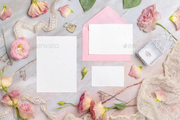 Wedding Wedding stationery set with envelope laying on a marble table