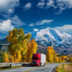 Red truck on highway in Colorado at autumn - PhotoDune Item for Sale